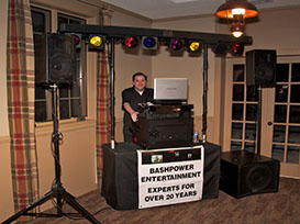 Photo of DJ Shawn and his equipment setup at an event